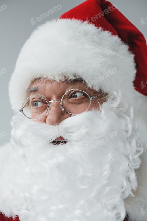 Preview: close-up portrait of cheerful santa claus in eyeglasses looking away