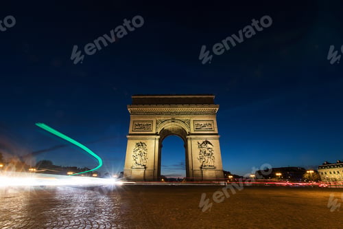 Preview: Traffic light trails at Arc De Triomphe in Paris, France at night