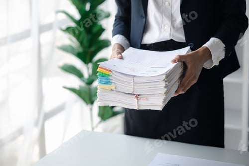 Preview: Businessman holding a lot of documents, corporate financial documents.