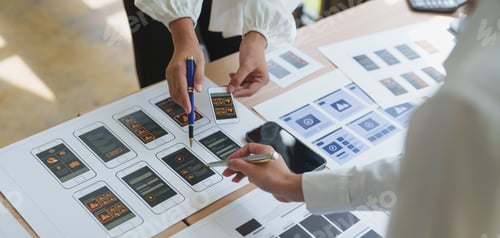 Preview: Web designers working on user interface and user experience of mobile application