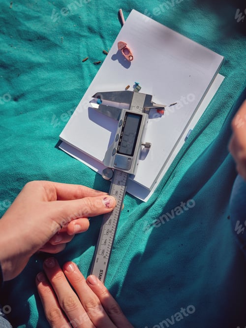Preview: Crop preteen girl adjusting digital caliper while measuring plas