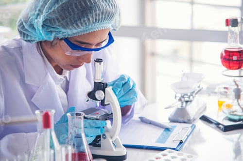 Preview: Woman scientist in lab look at science microscope medical test and research biology chemistry