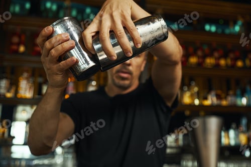 Preview: Caucasian Young Adult Man Mixing Cocktail Shaker Behind Bar Counter
