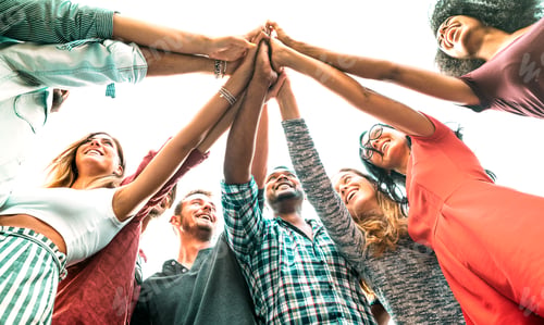 Preview: Young millenial friends stacking hand on high five move