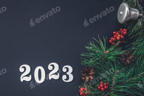Preview: Christmas background with numbers 2023 and decor details, flat lay.