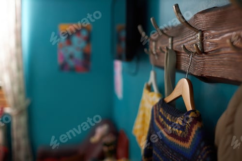 Preview: Clothes Hanging on Rustic Wooden Coat Rack