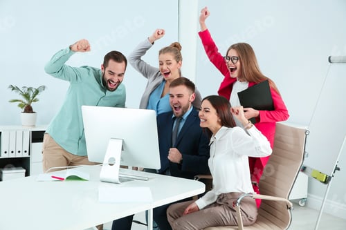 Preview: Group of office employees celebrating victory at workplace