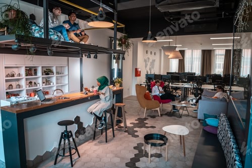 Preview: Group of casual multiethnic business people taking break from the work doing different things while