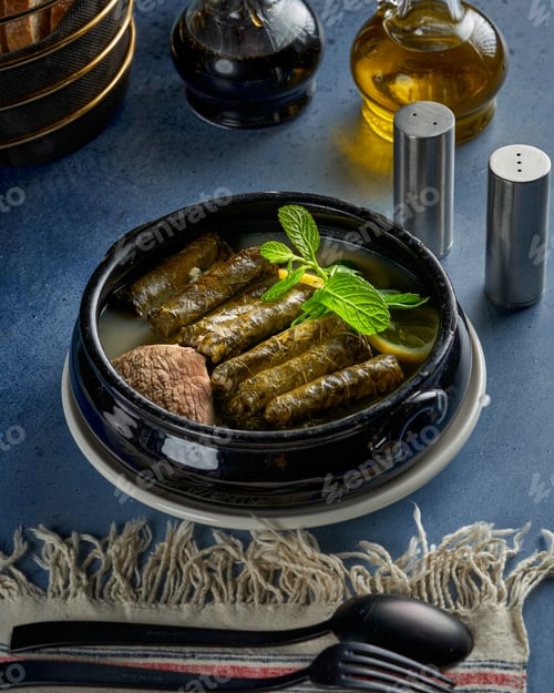 Preview: A plate of grape leaves stuffed with rice and meat