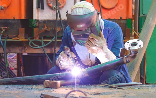 Preview: Welder is welding steel pipe for use in oil pipeline system renovate work in tanker ship