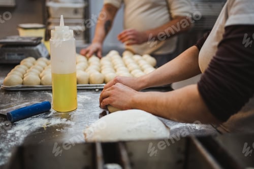 Preview: Baker woman kneading bread dough