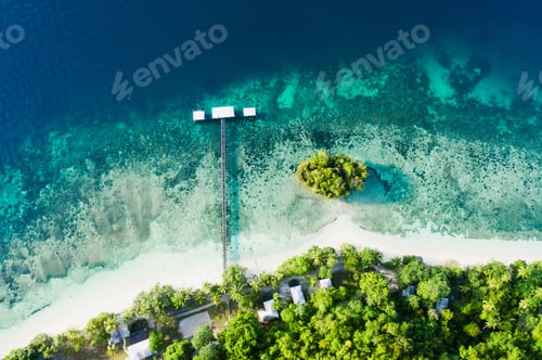 Preview: Its quiet on the coast. High angle shot of a clear blue ocean touching the coastline.