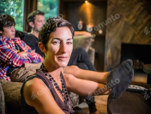 Preview: Portrait of woman sitting in front of her son and husband in living room