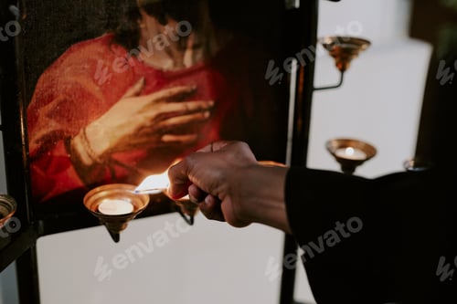 Preview: Unrecognizable Nun Lighting Up Candles