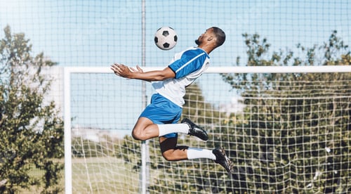 Preview: Sports, soccer and man in action with ball playing game, training and exercise on outdoor field. Mo