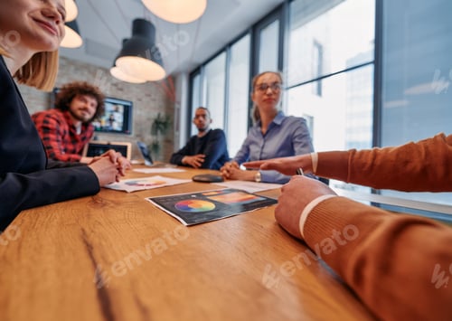 Preview: In the vibrant ambiance of a modern startup office, a diverse team of business professionals engage
