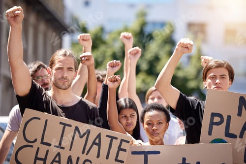 Preview: Fighting to save the earth. Shot of a group of people protesting climate change.