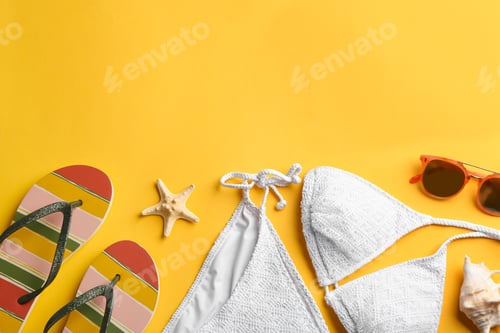 Preview: Flat lay composition with beach accessories on color background. Space for text