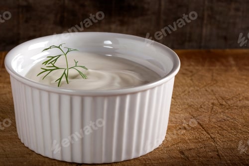 Preview: White bowl filled with sour cream