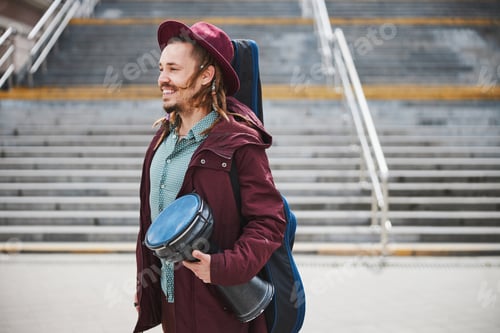 Preview: Handsome male person looking aside during walk