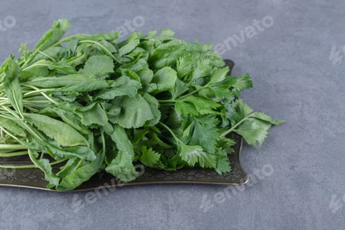 Preview: Fresh watercress on a tray, on the marble background
