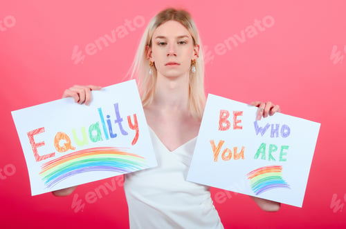 Preview: Portrait of young transgender woman on color background
