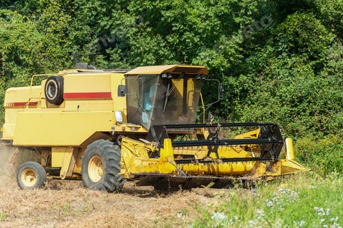 Preview: Combine harvester on a soy field