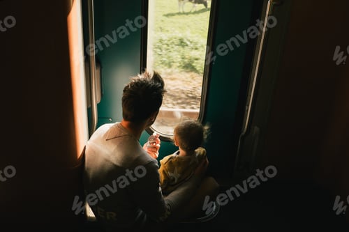 Preview: Father and child on train journey together