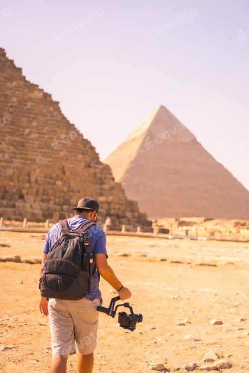 Preview: A Young Photographer At The Pyramid Of Cheops The Largest Pyramid. The Pyramids Of Giza The Oldest