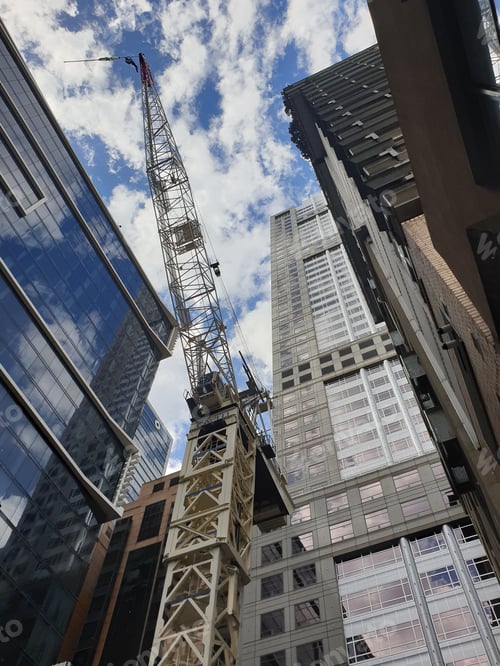 Preview: View of Cranes and building construction heavy equipment on site.