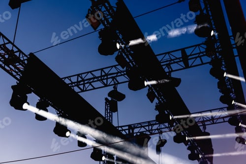 Preview: Installation of spotlights to illuminate a musical concert during rehearsals.