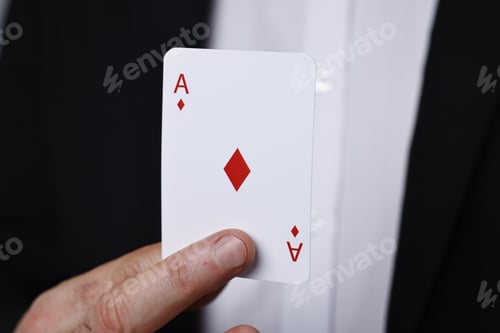 Preview: Professional illusionist with one playing card, closeup