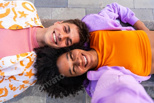 Preview: Modern cool male wearing stylish urban clothing strolling in the city