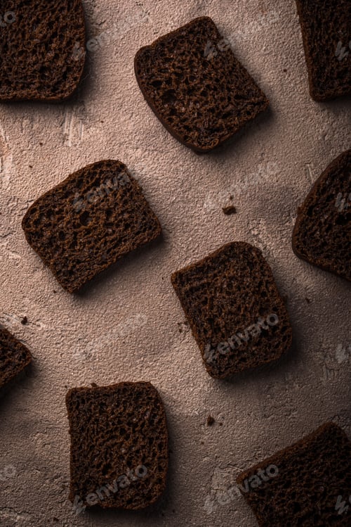 Preview: Dark rue bread on brown background
