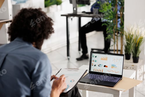 Preview: Entrepreneur preparing financial reports and analyzing market data