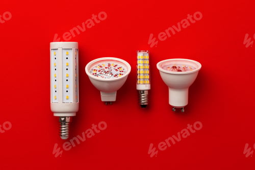 Preview: LED light bulbs on red background top view