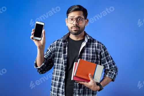 Preview: Adult student showing his phone.