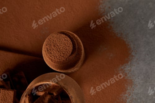 Preview: top view of delicious tiramisu with cocoa powder and chocolate pieces