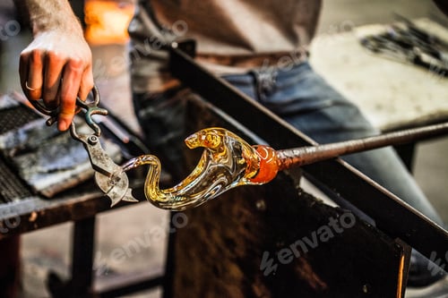 Preview: Man Hands Closeup Working on a Blown Glass Piece