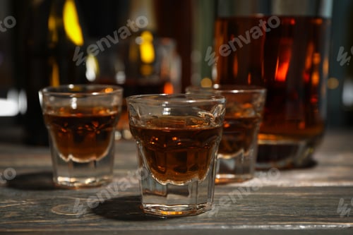 Preview: Whiskey shots on wooden table, close up