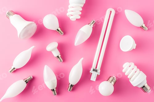 Preview: top view of various types of light bulbs on pink