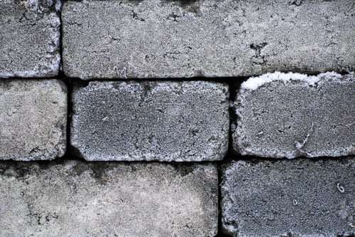 Preview: Gray brick wall with snow in cold winter