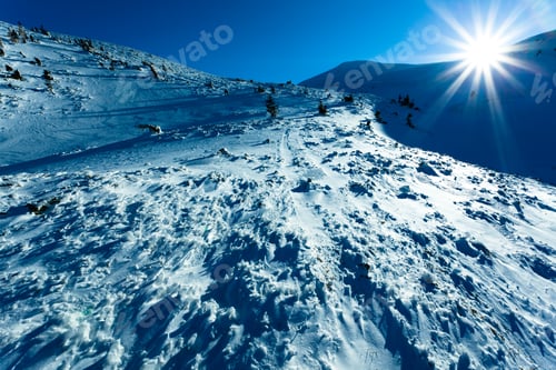 Preview: Landscape of snow winter valley and mountains on sunny day