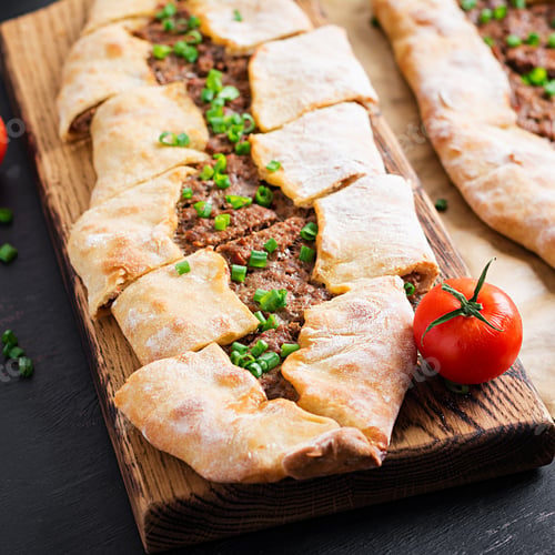 Preview: Turkish pide with minced meat, Kiymali Pide. Traditional Turkish cuisine.