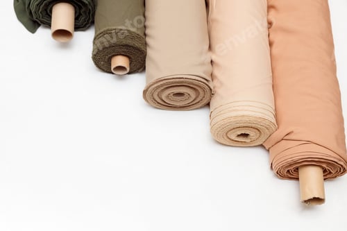 Preview: pastel color fabric rolls isolated on white, Synthetic and natural fabrics with copyspace.
