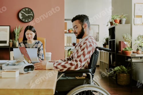 Preview: Bearded Man with Disability Coding in Office