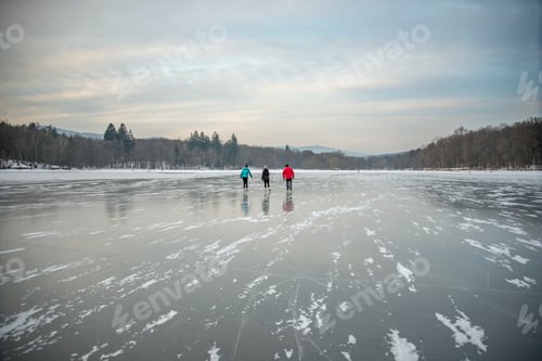Preview: People Ice Skating on Snowy Lake in Winter