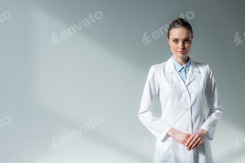 Preview: Woman in a White Lab Coat Looking Confidently