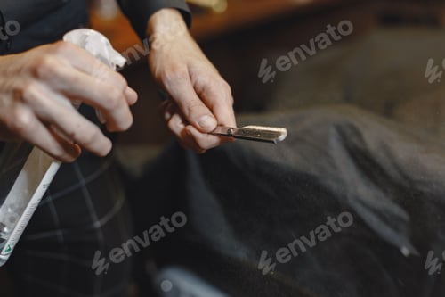 Preview: Barber razor in a profecional hand