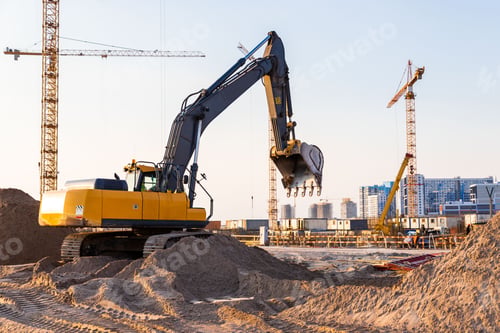 Preview: Group tower cranes and excavator silhouette at construction site, sunset sky background